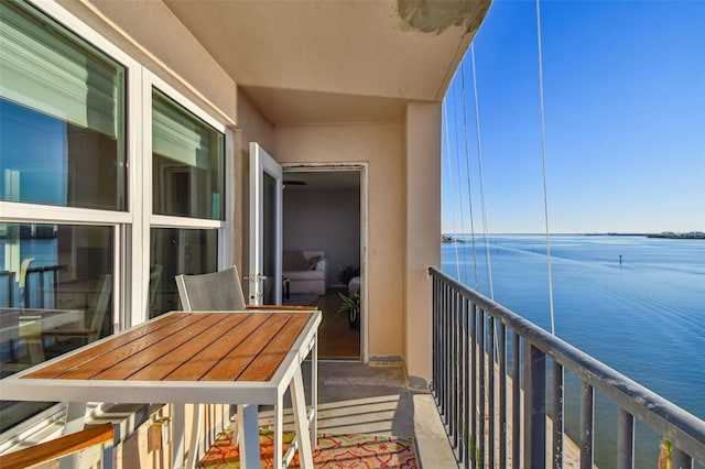 balcony featuring a water view