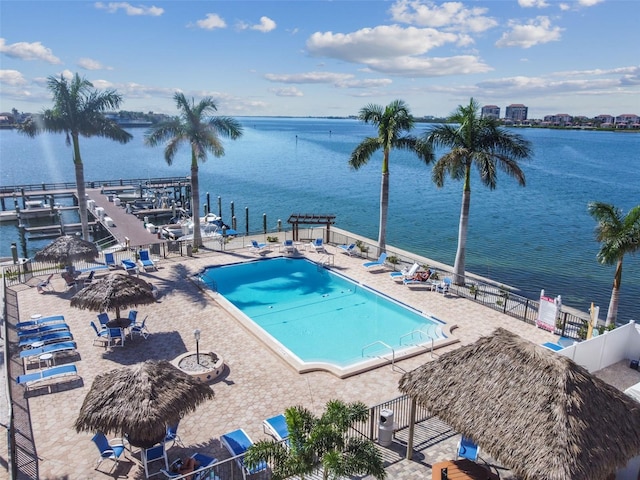 view of pool with a gazebo, a water view, and a patio