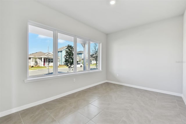 spare room with light tile patterned floors