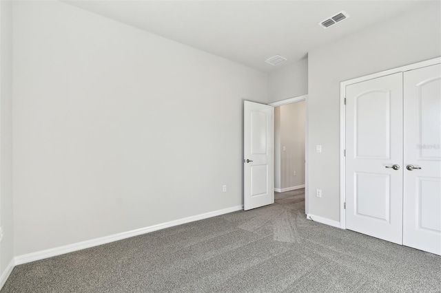 unfurnished bedroom featuring a closet and carpet