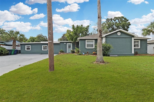 ranch-style home featuring a front yard