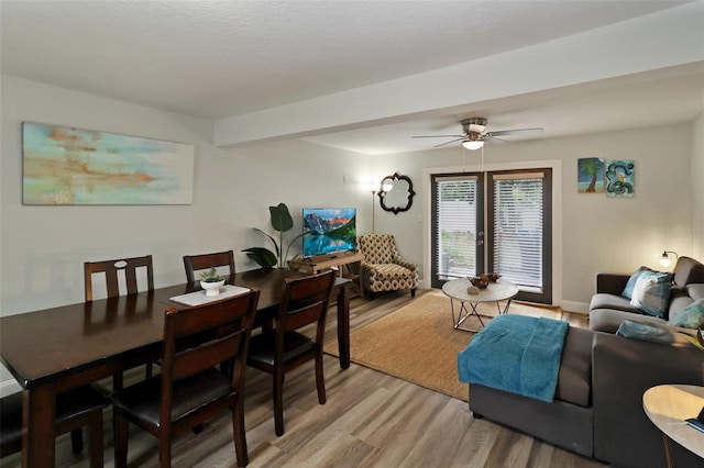 dining space featuring ceiling fan and light hardwood / wood-style floors