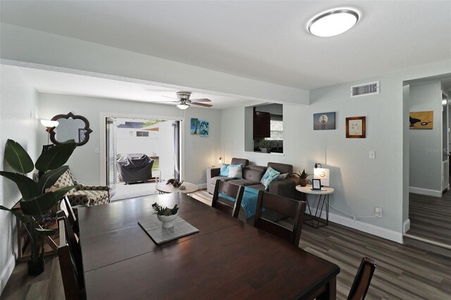 dining room with dark hardwood / wood-style floors and ceiling fan