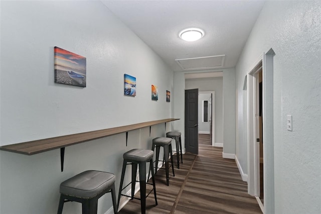 hall with dark hardwood / wood-style floors