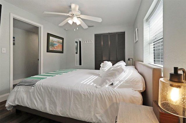 bedroom with a closet, ceiling fan, and hardwood / wood-style flooring