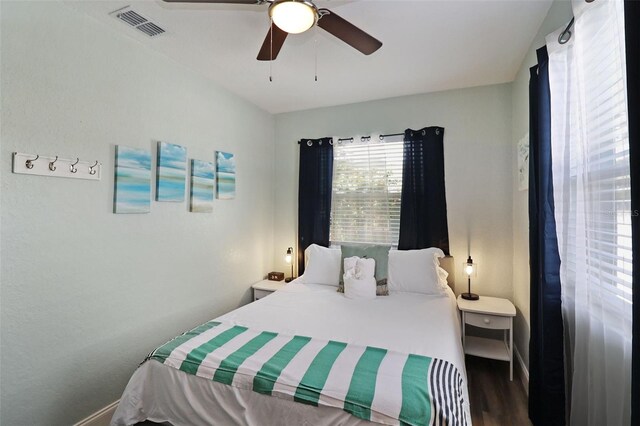 bedroom with hardwood / wood-style flooring and ceiling fan