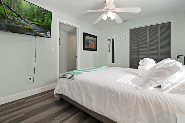 bedroom featuring a closet, ceiling fan, and dark wood-type flooring