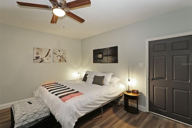 bedroom featuring dark hardwood / wood-style floors and ceiling fan