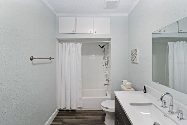 full bathroom featuring wood-type flooring, shower / tub combo, toilet, and crown molding