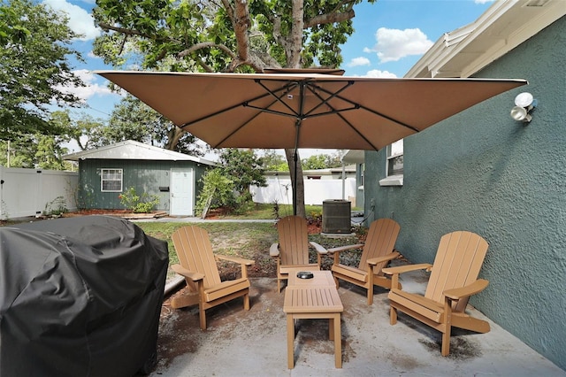 view of patio / terrace featuring a grill and cooling unit