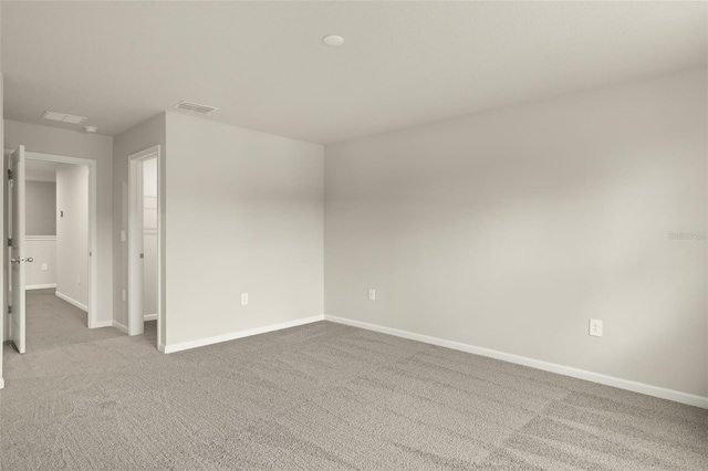 empty room with light colored carpet