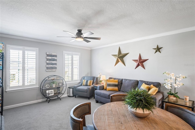 carpeted living room with ceiling fan, ornamental molding, and a textured ceiling