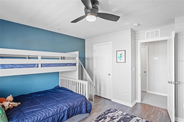 bedroom featuring hardwood / wood-style floors and ceiling fan