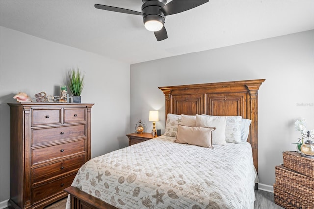 bedroom featuring hardwood / wood-style floors and ceiling fan