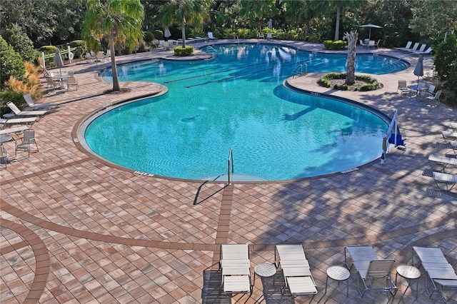 view of swimming pool featuring a patio area