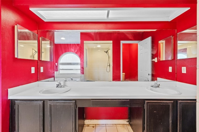 bathroom with vanity, a shower, and ornamental molding