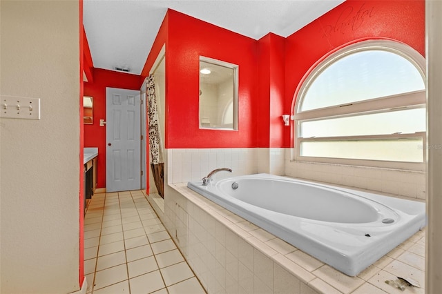 bathroom featuring tile patterned flooring, vanity, a healthy amount of sunlight, and shower with separate bathtub