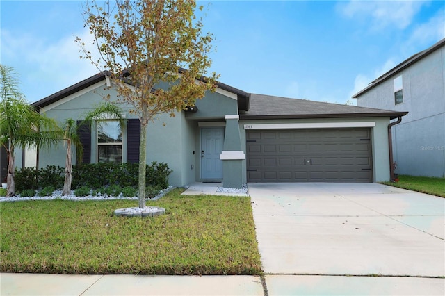 single story home with a garage and a front yard