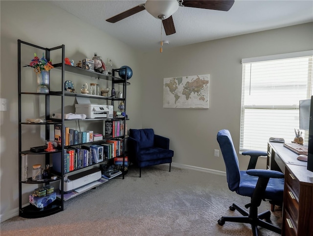 office space featuring carpet and ceiling fan