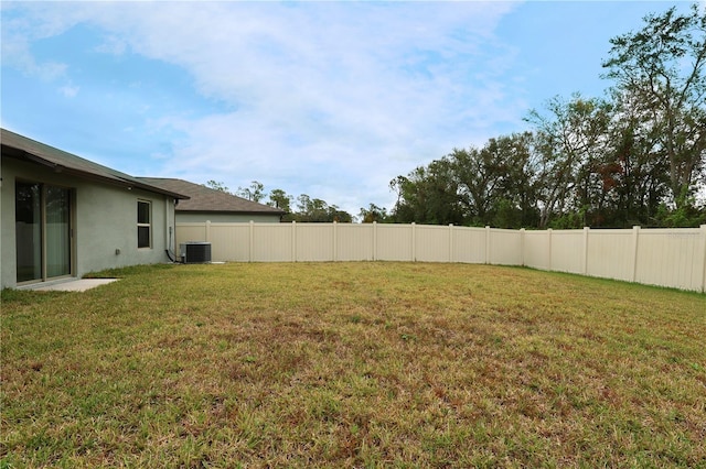 view of yard featuring central AC unit