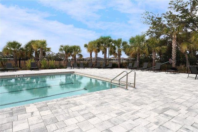 view of swimming pool featuring a patio