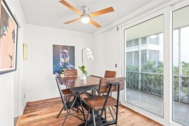 dining area with light wood-type flooring, plenty of natural light, and ceiling fan