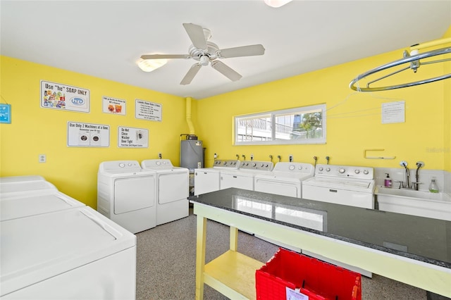 laundry area featuring ceiling fan, independent washer and dryer, and sink