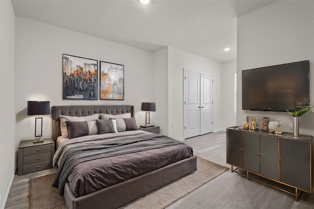 bedroom featuring light hardwood / wood-style floors and a closet