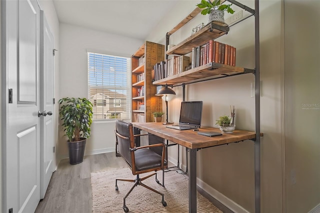 office area with light hardwood / wood-style flooring