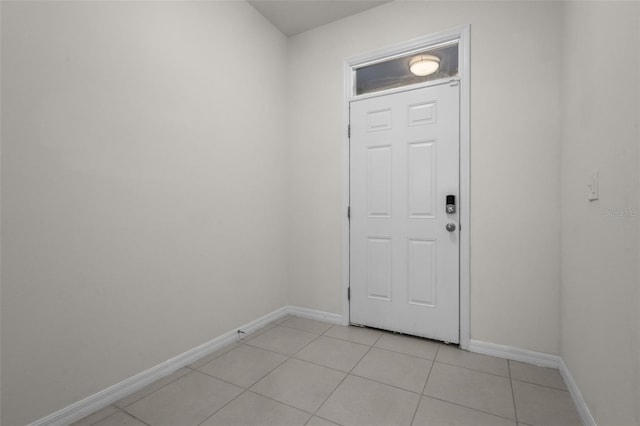 doorway featuring light tile patterned flooring