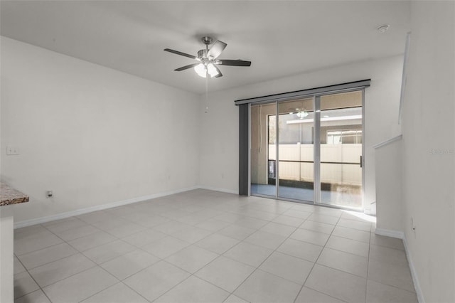 unfurnished room featuring light tile patterned floors and ceiling fan