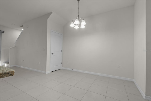 interior space featuring light tile patterned floors and a chandelier