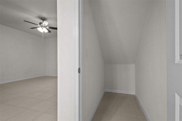 additional living space featuring vaulted ceiling, ceiling fan, and light tile patterned flooring