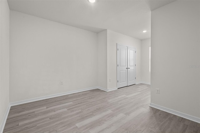 unfurnished room featuring light hardwood / wood-style floors