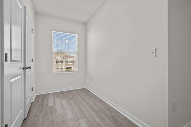 spare room featuring light wood-type flooring