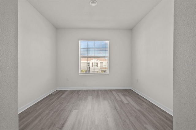 unfurnished room featuring light hardwood / wood-style floors