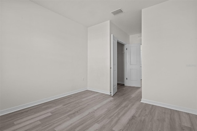 spare room with light wood-type flooring