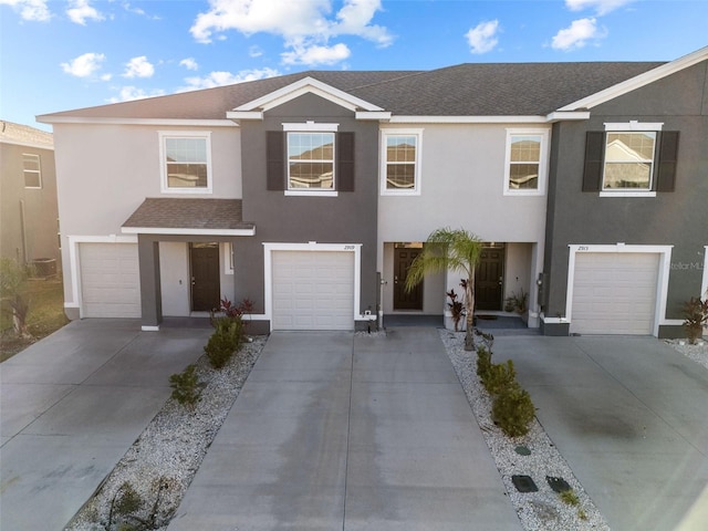 townhome / multi-family property featuring a garage