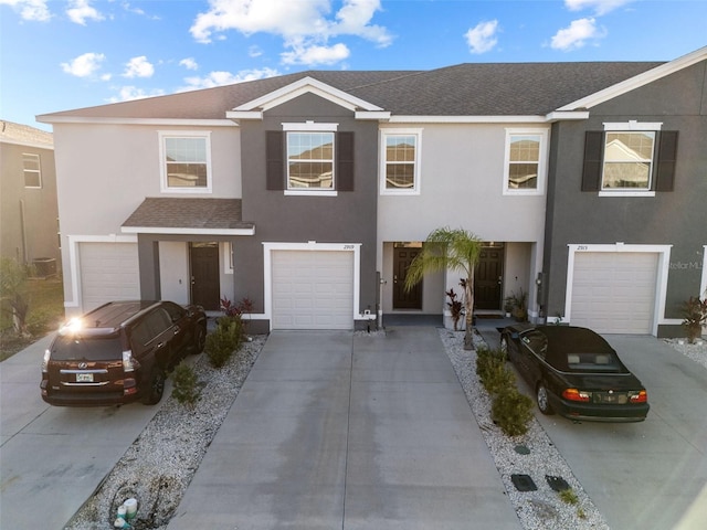 townhome / multi-family property featuring a garage