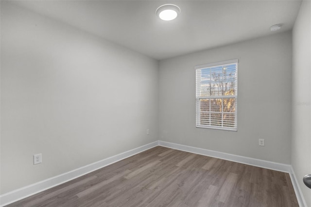 spare room featuring hardwood / wood-style flooring