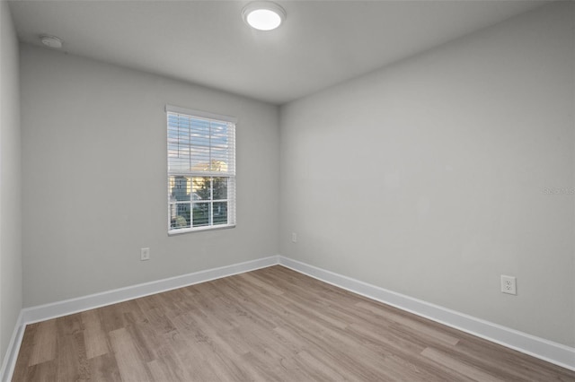 unfurnished room with light hardwood / wood-style flooring