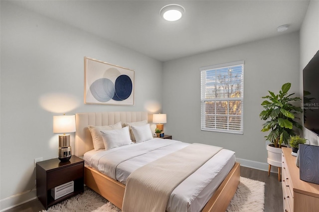 bedroom with hardwood / wood-style flooring