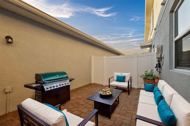 view of patio featuring outdoor lounge area and a grill