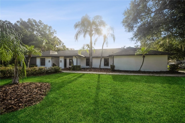 view of front of home with a front lawn