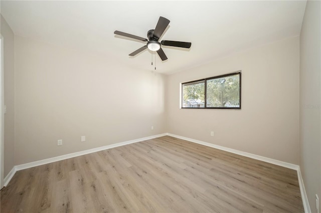 unfurnished room featuring light hardwood / wood-style flooring and ceiling fan