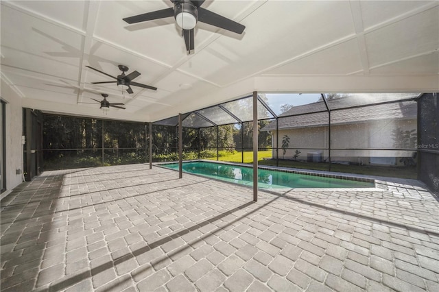 view of swimming pool featuring a patio area and glass enclosure