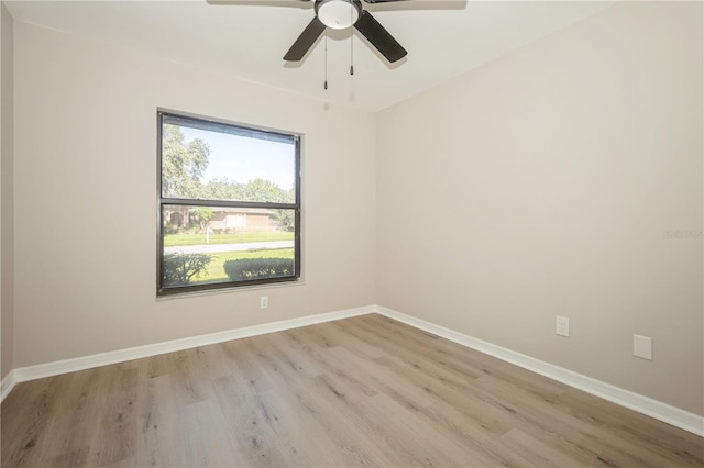 unfurnished room with light wood-type flooring and ceiling fan