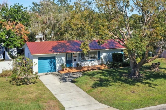 ranch-style house with a garage, a porch, and a front yard