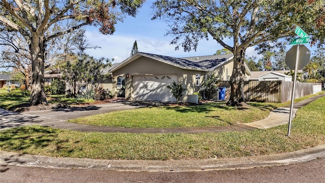 view of front facade with a garage and a front lawn