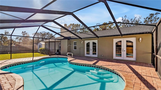 view of swimming pool with french doors, glass enclosure, and a patio area